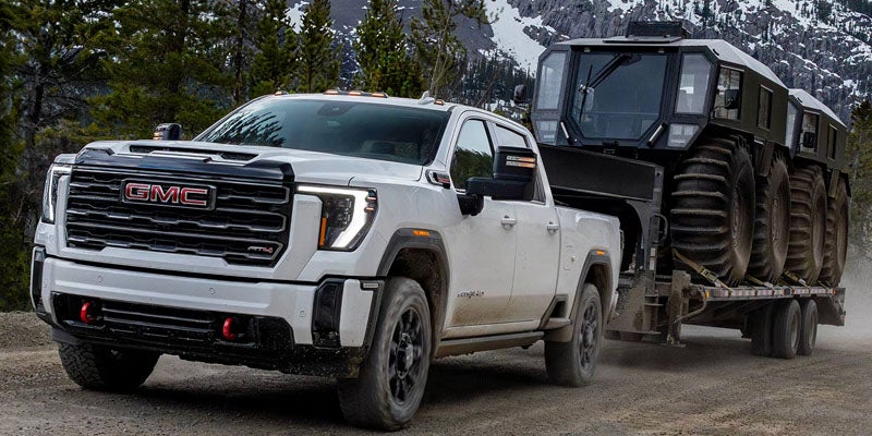 2026 GMC Sierra 2500 HD towing heavy equipment